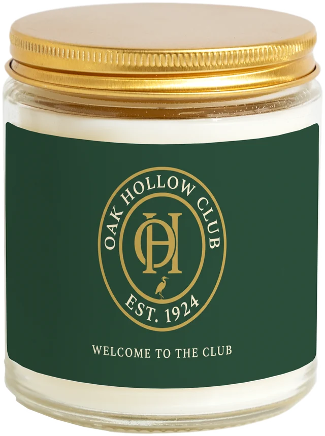 A 9 oz candle jar with a sample Club & membership welcome gifts label