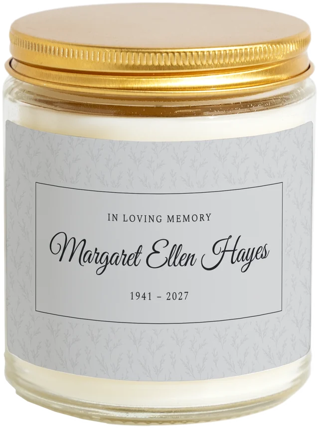 A 9 oz candle jar with a sample Celebration of life favors label