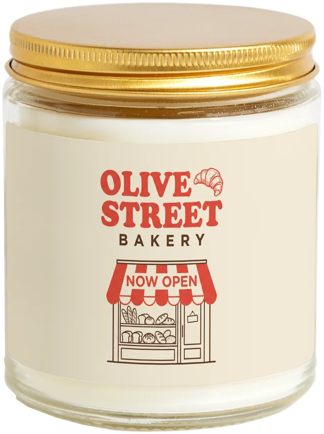 A 9 oz candle jar with a sample Grand opening favors label