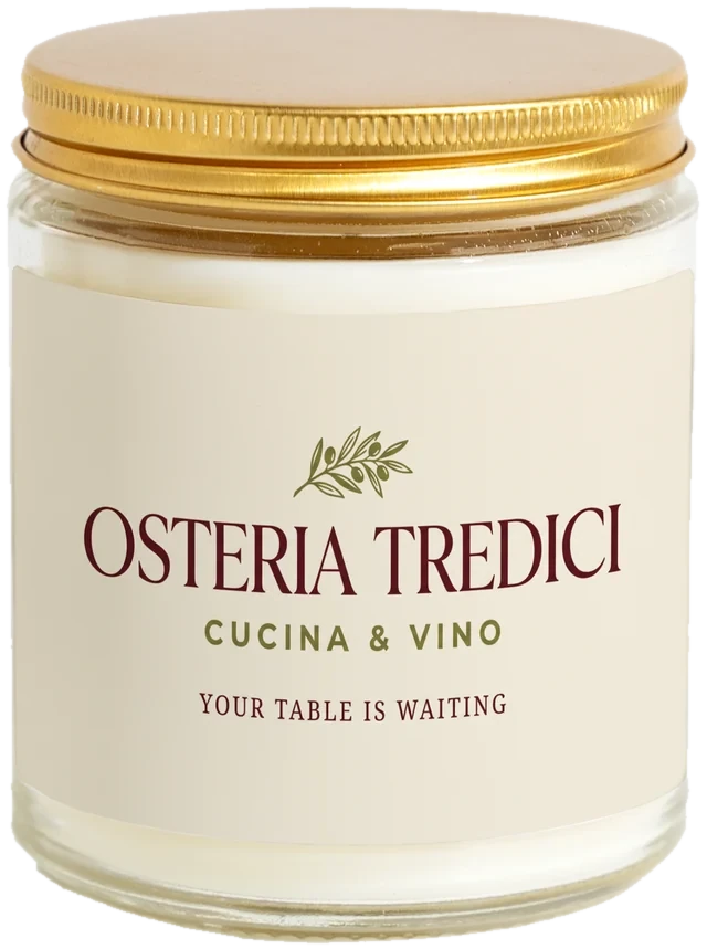 A 9 oz candle jar with a sample Restaurant & bar VIP gifts label