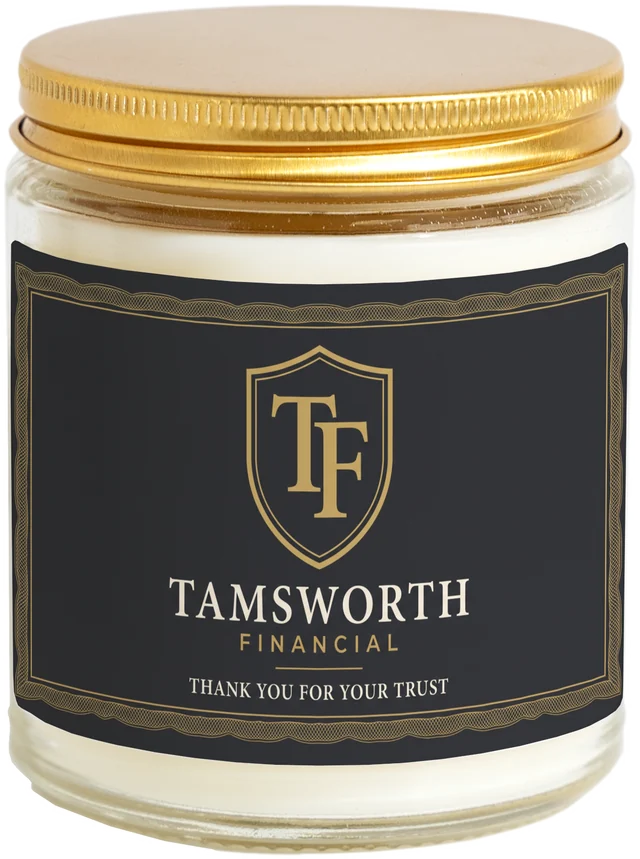 A 9 oz candle jar with a sample Financial advisor client gifts label
