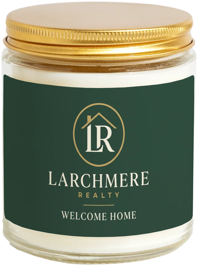 A 9 oz candle jar with a sample Realtor closing gifts label