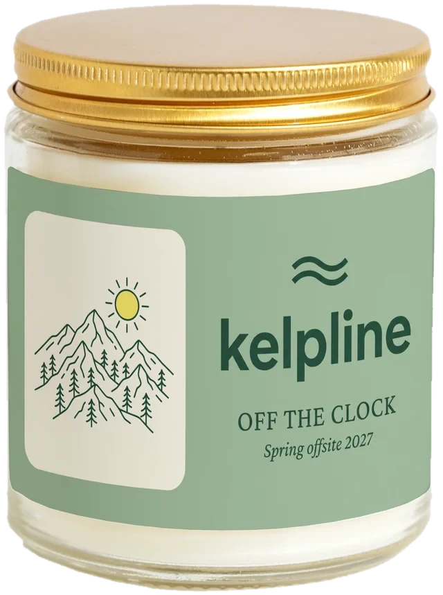 A 9 oz candle jar with a sample Corporate retreat gifts label