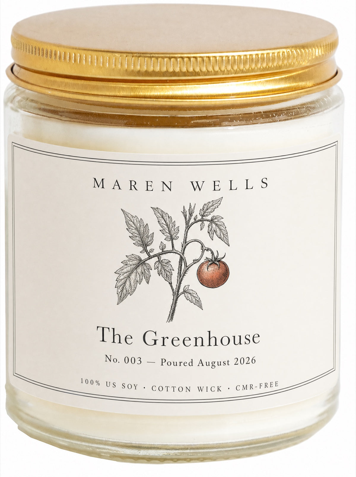The Greenhouse candle in a clear glass jar with a brushed gold lid and botanical label