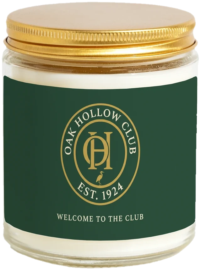 A 9 oz candle jar with a sample Club & membership welcome gifts label