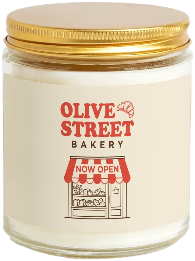 A 9 oz candle jar with a sample Grand opening favors label