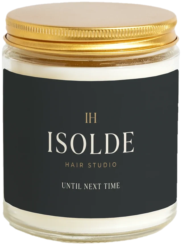 A 9 oz candle jar with a sample Salon & barbershop client gifts label