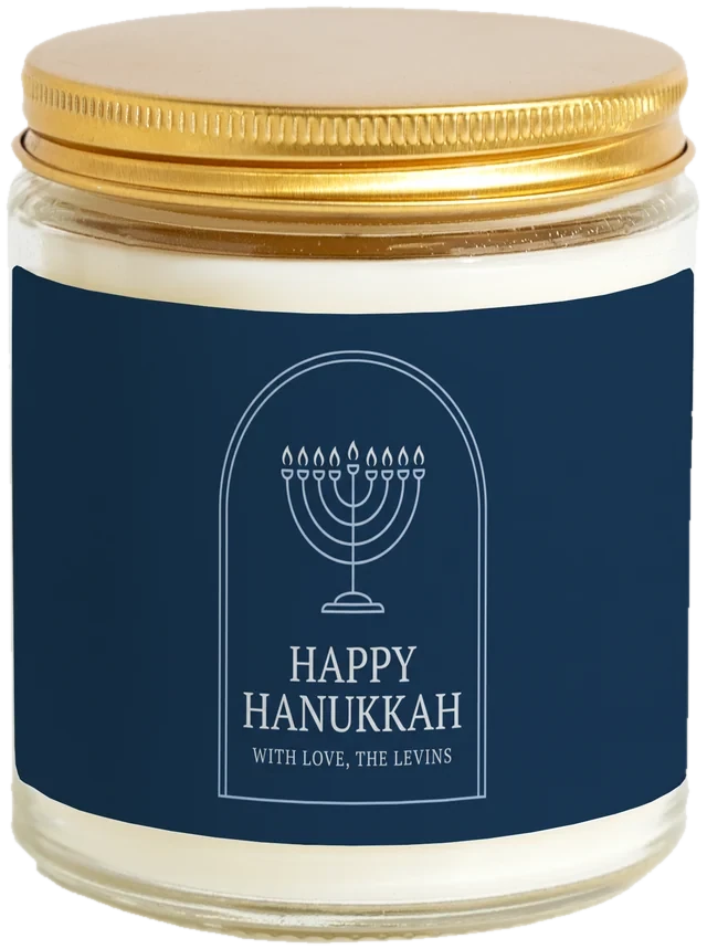 A 9 oz candle jar with a sample Hanukkah gifts label