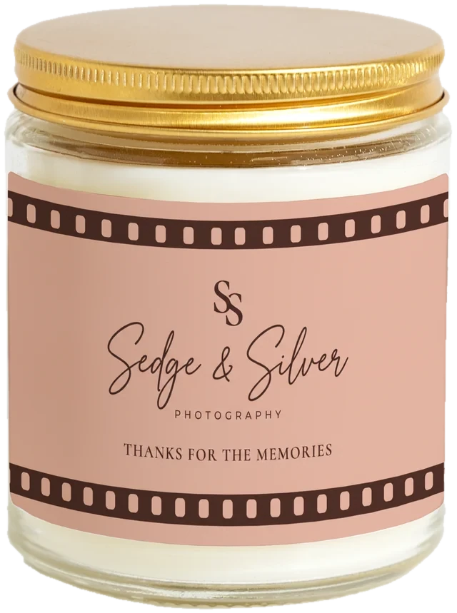 A 9 oz candle jar with a sample Photographer client gifts label