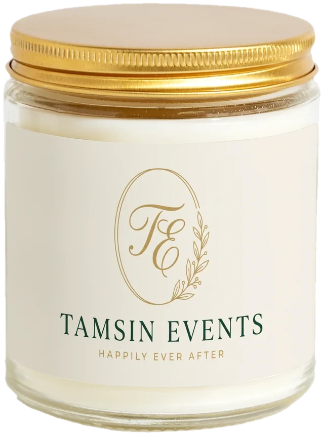 A 9 oz candle jar with a sample Wedding planner client gifts label