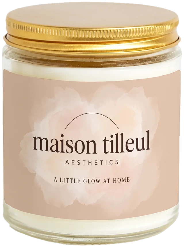 A 9 oz candle jar with a sample Med spa client gifts label