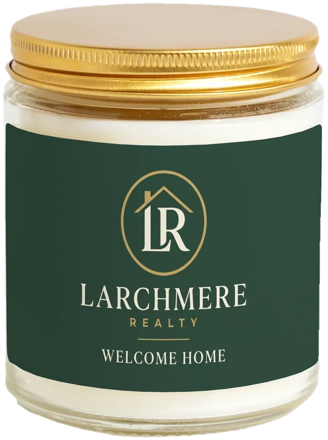A 9 oz candle jar with a sample Realtor closing gifts label