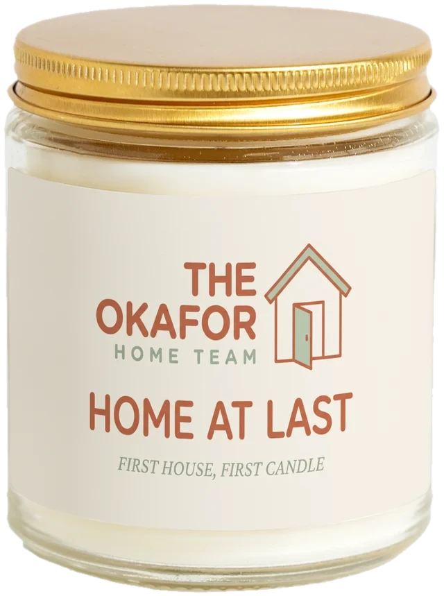 A 9 oz candle jar with a sample First-time buyer gifts label